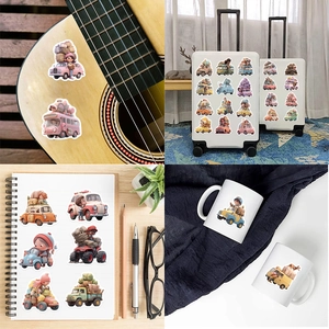 Variety of cartoon vehicle stickers applied on suitcases, guitars and notebooks