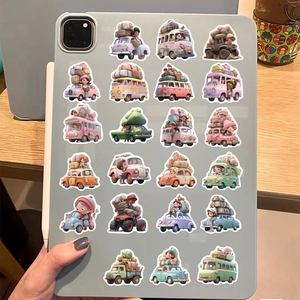 Macaron-colored travel stickers on a tablet back showing cartoon cars and luggage details