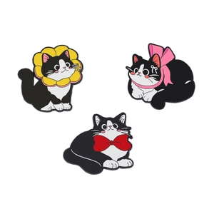 Set of three cute black and white cat enamel pins with floral and bow tie decorations