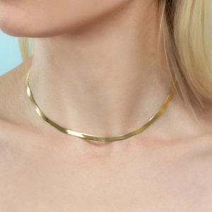 Flat gold snake bone chain necklace in polished stainless steel for a minimalist look