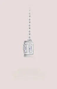 Macro shot of square cut moissanite pendant with four-prong silver setting on O-chain