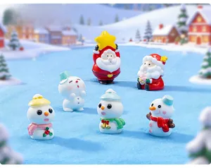 Miniature resin Christmas figurines set featuring Santa and snowmen for holiday decor