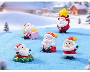 Close-up of 5-piece resin Santa Claus miniature figurines for Christmas micro landscapes