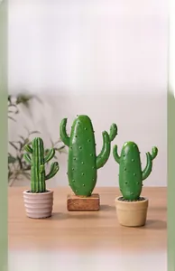 Three creative Nordic resin cactus plants on a wooden table for home decor