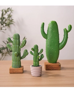 Three creative Nordic resin cactus figurines with realistic textures on a wooden table