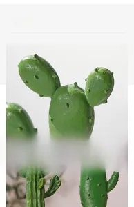 Close-up of artificial resin cactus showing realistic texture and natural green spikes