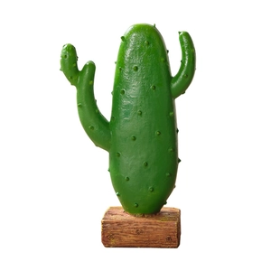 Nordic style resin cactus decor with green textured plant on a brown wood-grain base