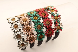Macro detail of multicolored rhinestone sunflower headbands with marquise-cut crystals