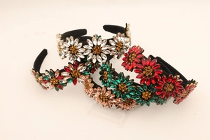 Detailed view of handmade rhinestone headbands with colorful crystal sunflower patterns