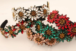 Detailed close-up of handmade sunflower rhinestone headbands in multiple vibrant colors
