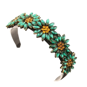 Sparkling sunflower headband with green crystal petals and yellow rhinestone center