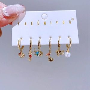Golden sea animal charm earrings set with shell seahorse whale and turtle pendants