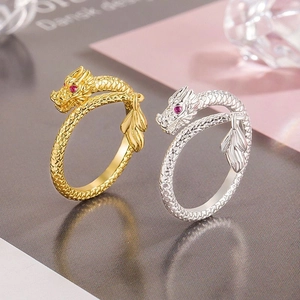 Exquisite gold and silver dragon wrap rings with ruby eyes and detailed dragon scales