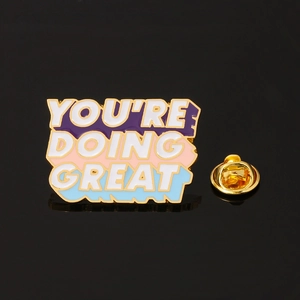 Close-up of You're Doing Great enamel pin with gold plating and butterfly clutch