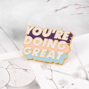 Colorful You're Doing Great enamel pin with gold plating on a floral card base