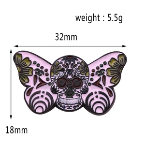Detail view of pink moth skull enamel pin showing dimensions 32mm by 18mm and 5.5g weight