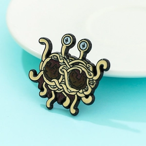 Flying Spaghetti Monster enamel pin with meatballs and noodles on light blue background