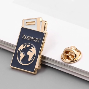 Detail of blue passport enamel pin with gold lettering and butterfly clutch back