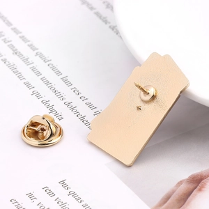 Golden earth lapel pin with butterfly clutch back and durable textured metal finish