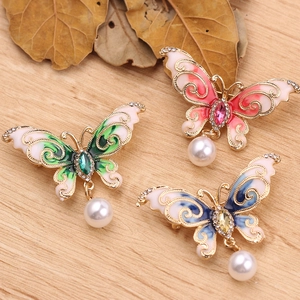 Exquisite butterfly brooches with colorful enamel, sparkling crystals, and pearl pendants
