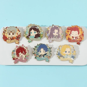 Close-up of 7 colorful enamel pins from The Land of Warriors on a white ceramic display tray