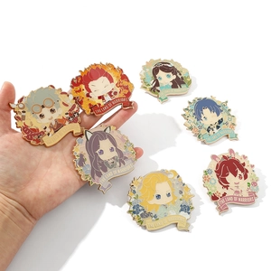 Detailed macro view of seven Soul Land anime enamel pins with gold trim and ribbon base