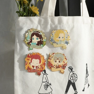 Set of four Douluo Continent anime enamel pins pinned on a white canvas tote bag