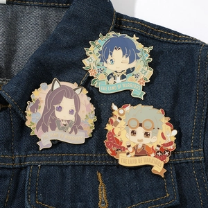 Detailed close-up of colorful enamel anime pins on denim featuring cute chibi characters