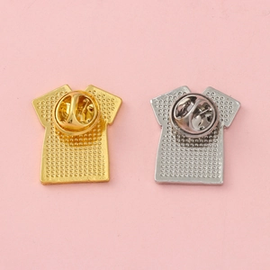 Golden and silver T-shirt shaped metal pins with textured surface and butterfly clutches