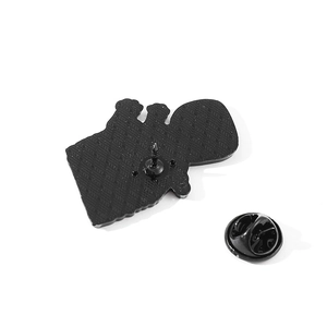 Black enamel pin back view featuring textured metal finish and butterfly clasp