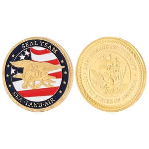 Detailed macro view of US Navy SEAL challenge coins with enamel flag and golden relief finish