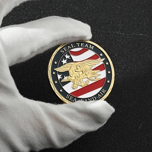 Detailed view of Navy SEAL Team challenge coin featuring eagle, trident and anchor symbols