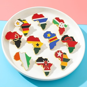 Detailed set of ten African map enamel pins featuring national flags on ceramic tray