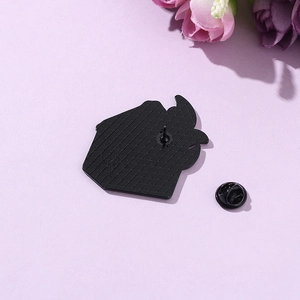 Dumpster fire enamel pin back view with black rubber clutch on lavender background