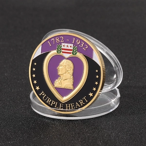 Detailed close-up of a gold-plated Purple Heart medal coin with Washington relief