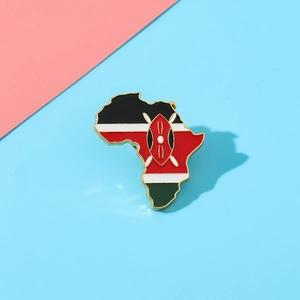Close-up of Kenya map enamel pin featuring national flag colors and Maasai shield icon