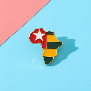Macro detail of Togo flag enamel pin in Africa map shape with gold plated zinc alloy edge