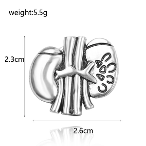 Silver kidney anatomical brooch with detailed texture measuring 2.6cm x 2.3cm and 5.5g weight