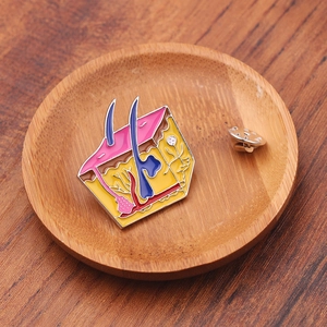 Macro view of human skin anatomy enamel pin with colorful dermis layers on wood background