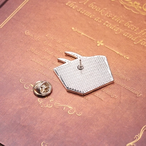 Detailed back view of a silver organ brooch with a secure metal butterfly clutch