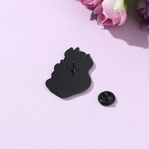 Black metal enamel pin with butterfly clasp back and matte textured alloy finish