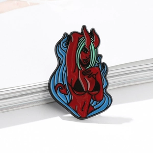 Enamel pin featuring a red succubus with green hair and blue flames on a metal badge