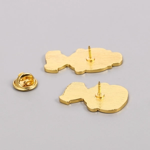 Cartoon artist metal pin badges with golden butterfly clasp backs shown from above