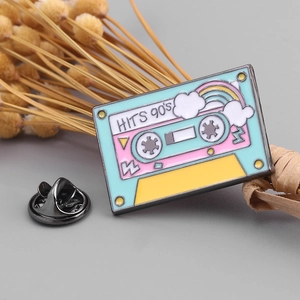Vintage 90s hits cassette enamel pin with rainbow design and butterfly clasp backing