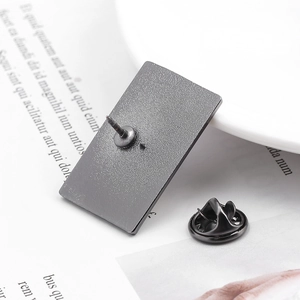 Detail shot of the rectangular metal pin back with black butterfly clutch and matte finish