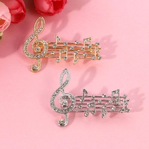 Elegant musical note brooch set with white crystals in gold and silver plating
