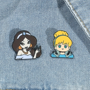 Cute Jasmine and Cinderella enamel pins set on blue denim background for bag decor