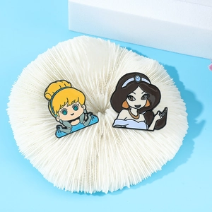 Cute enamel pins featuring cartoon Cinderella and Jasmine characters on blue background