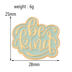Detail of Be Kind cloud enamel pin with dimensions 28x25mm and mint green finish
