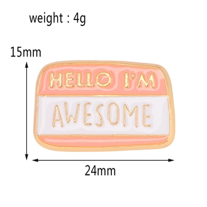 Pink and white enamel pin with golden Hello I'm Awesome text for clothes and bags